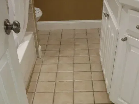 Before - Cleaning bathroom floor with beige tiles
