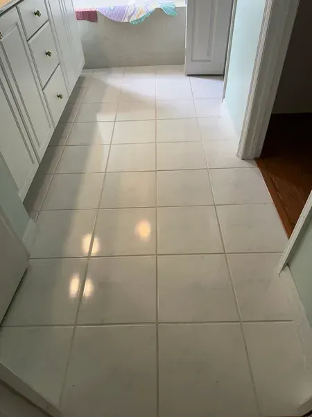 White tiled kitchen floor.