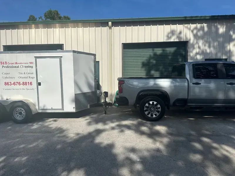 Silver pickup truck towing.