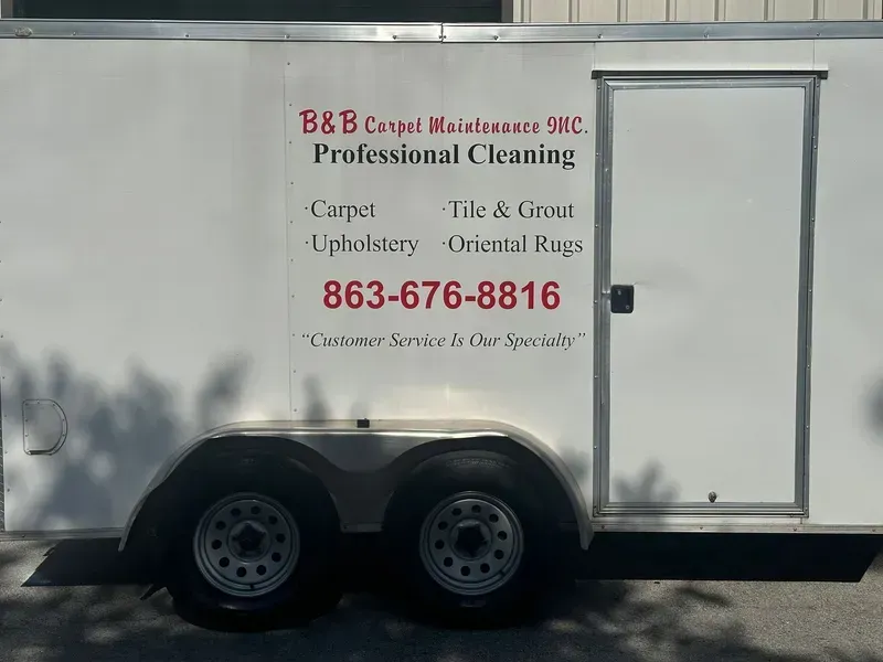 White trailer with B&B Carpet Maintenance logo.