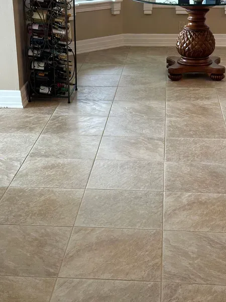 Beige square tile floor in a room.