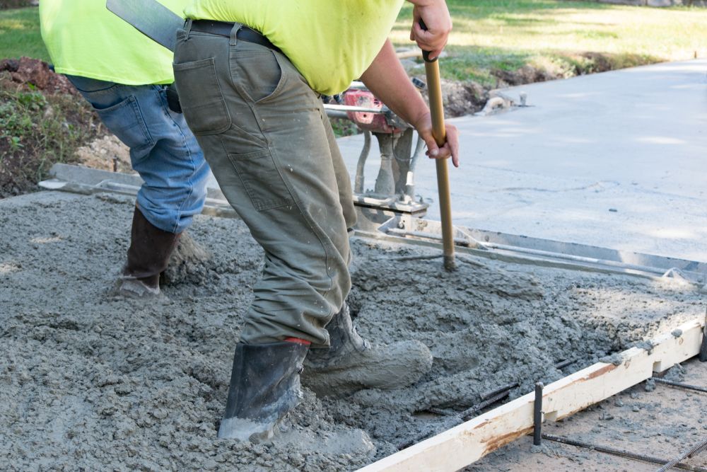 Workers Smoothing Fresh Concrete With Tools — All Around Concreting in Ballina, NSW