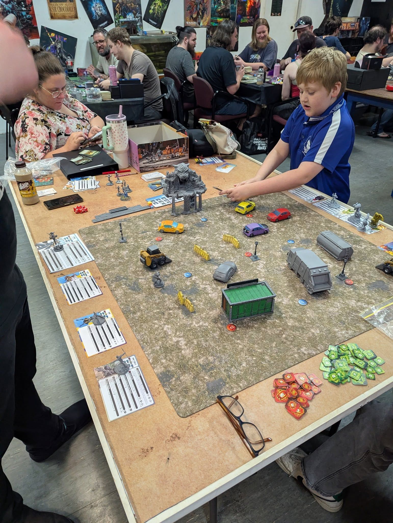 A Child Plays a Tabletop Wargame at a Convention — Grim Gaming & Hobbies in Bundaberg Central, QLD