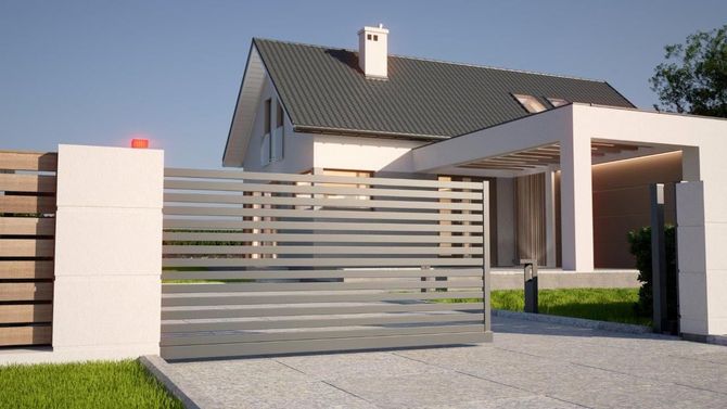 Una casa moderna con un cancello scorrevole davanti
