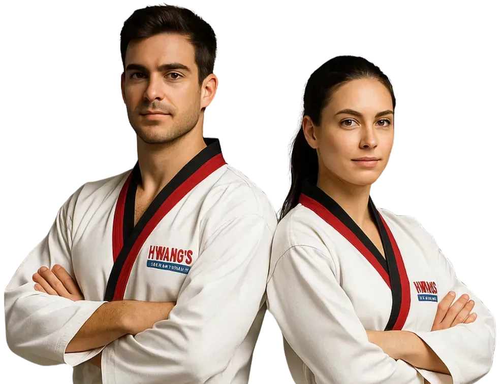 Three children in karate uniforms are sitting on the floor and giving a thumbs up.