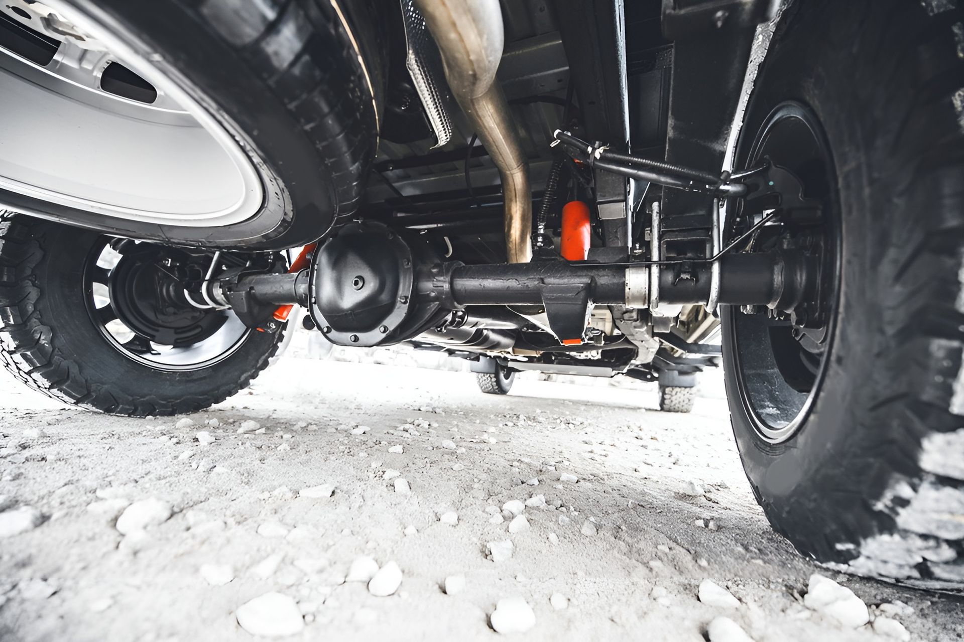 Undercarriage of A Vehicle with Axle, Suspension, and Tires — Bundaberg Field Service in Bundaberg East, QLD