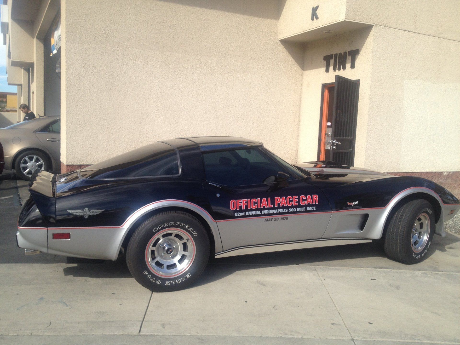 A black and silver car that says official pace car on the side