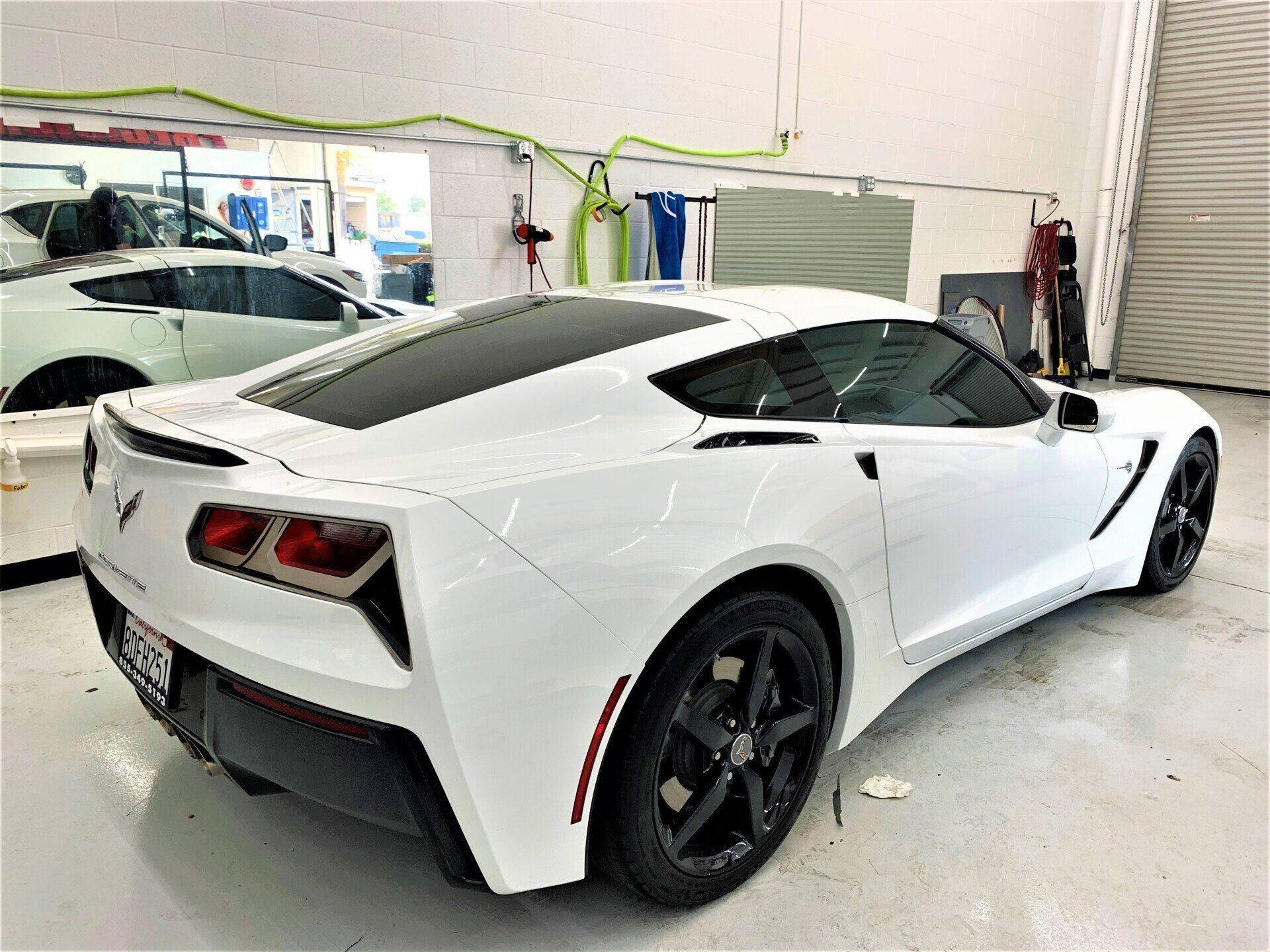 A White Sports Car Inside the Garage — Hemet, CA — Precision Window Tinting