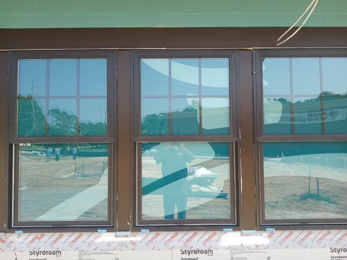 A building under construction with a lot of windows