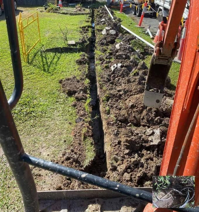 A Crane is Digging a Hole in the Ground in a Yard — Adzcom Civils in Portsmith, QLD