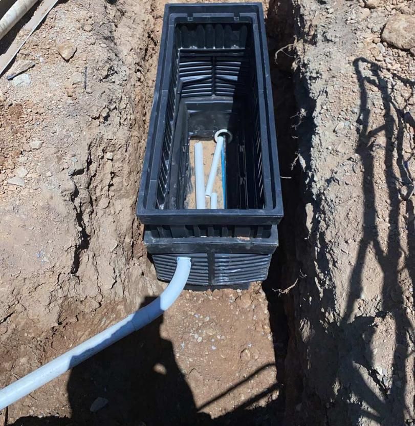 Black Plastic Pots Installed After Excavation — Adzcom Civils in Port Douglas, QLD