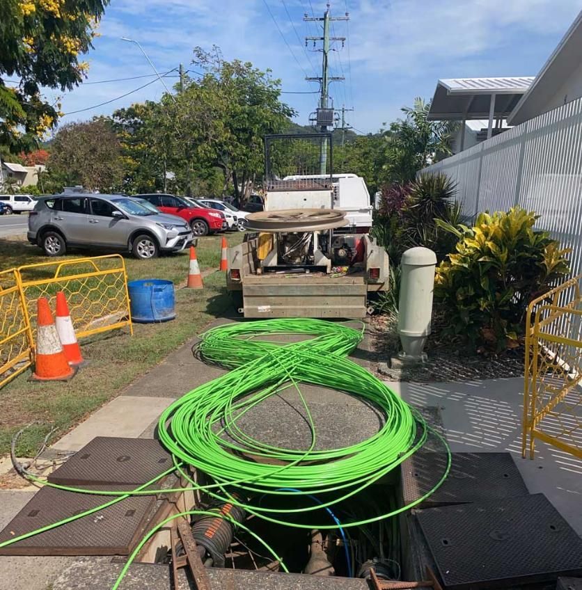 Green Fibre Optic Cable Lying on the Ground — Adzcom Civils in Portsmith, QLD
