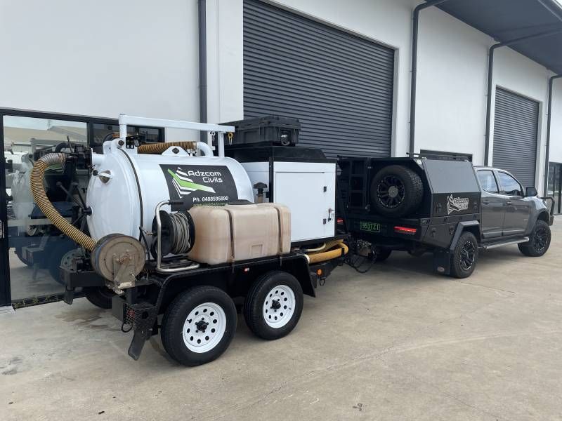 Work Vehicle parked outside sheds— Adzcom Civils in Portsmith, QLD