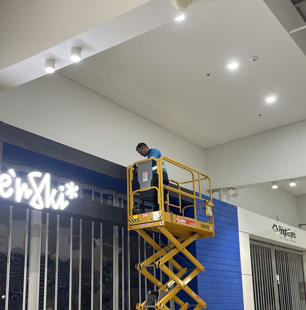 A Man on a Scissor Lift at Work — Adzcom Civils in — Adzcom Civils in Innisfail, QLD