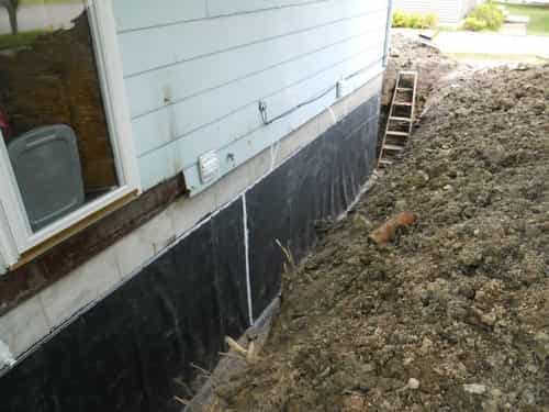 Foundation Repair with outside drain tile with a rubber liner