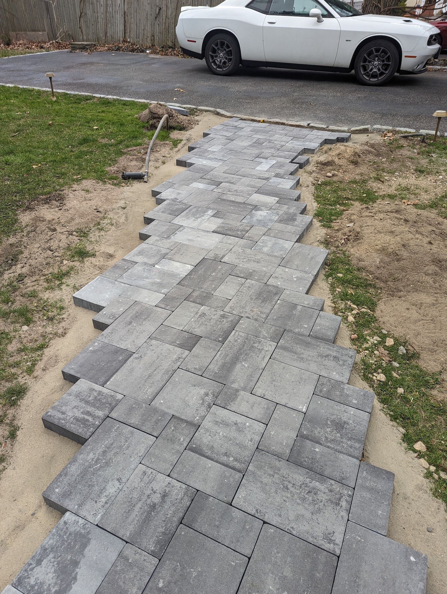 new paver walkway  to the driveway in progress