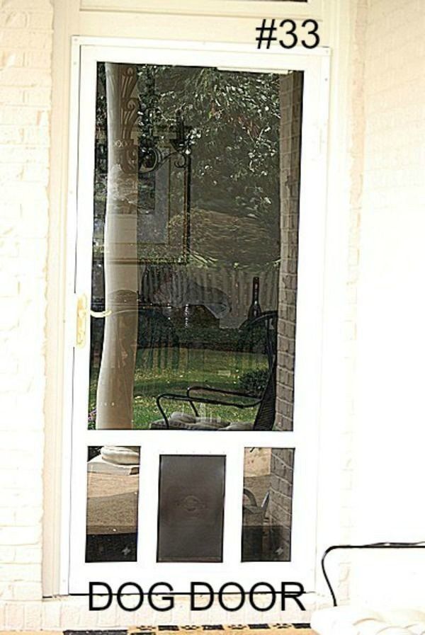 a white screen door with a dog door on it .