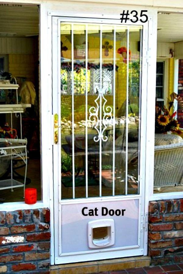 a white door with a cat door attached to it