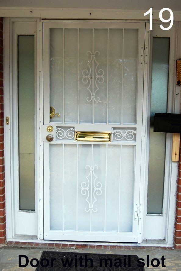 a white door with a mail slot underneath it