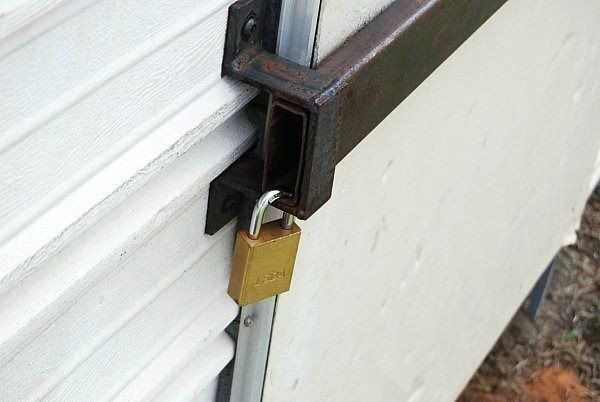 a padlock is attached to the side of a garage door .