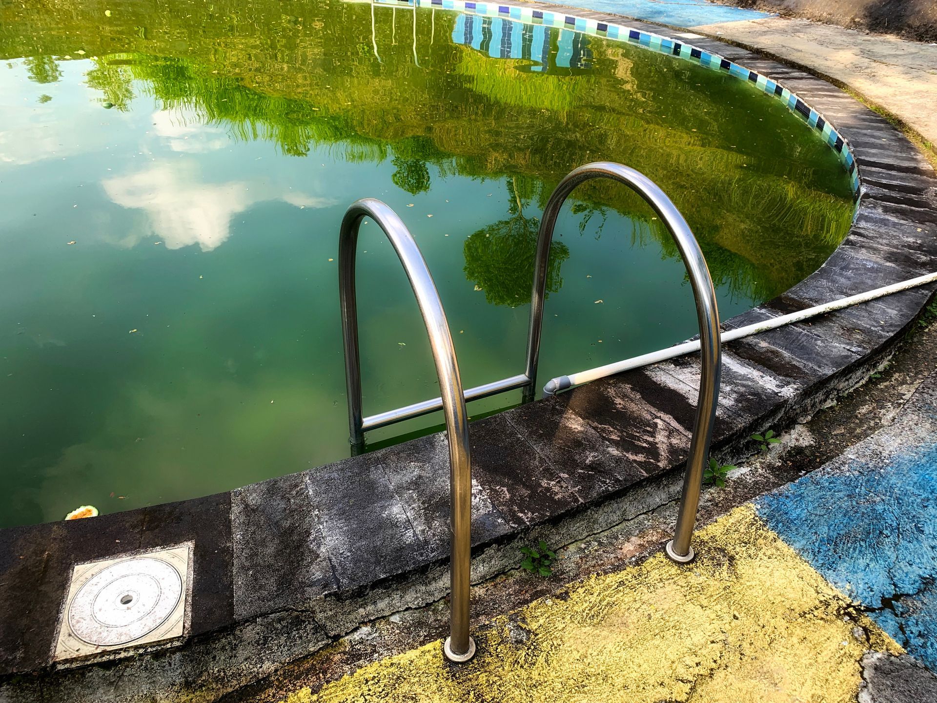 An abandoned, decaying pool. An abandoned, decaying pool.