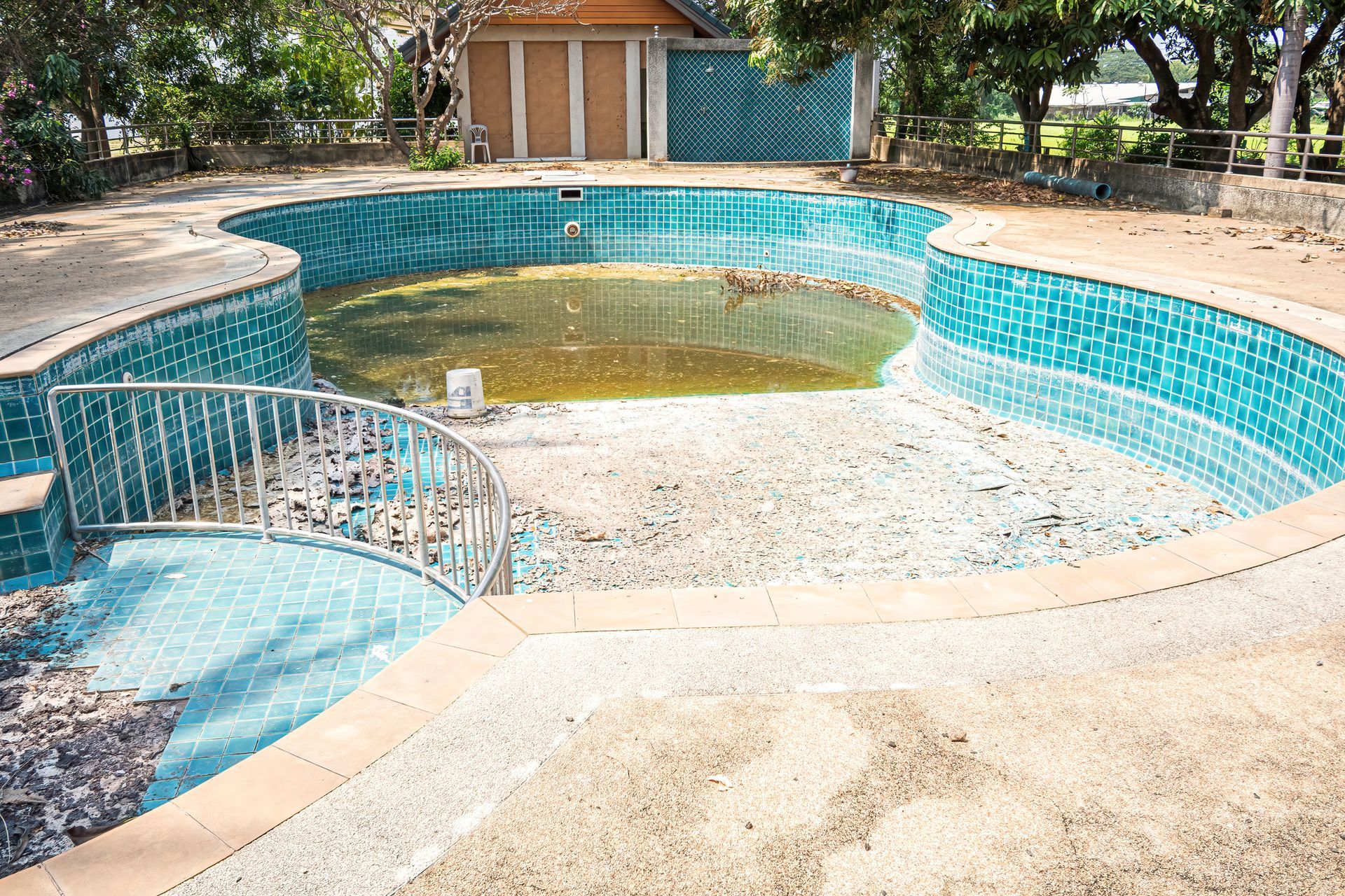 Abandoned swimming pool in the garden house. Abandoned swimming pool in the garden house.