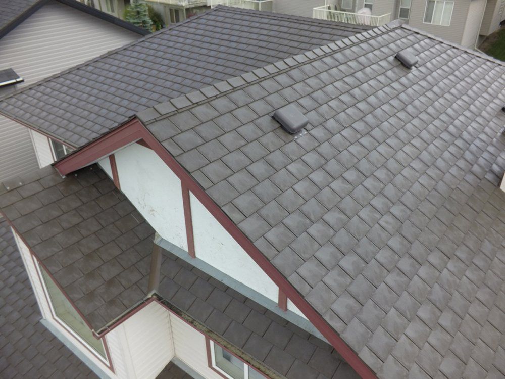 Rubber Roof Image of a home with a gray rubber roof