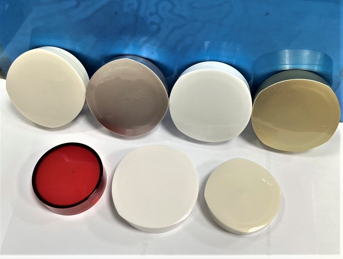 A bunch of different colored circles on a white surface