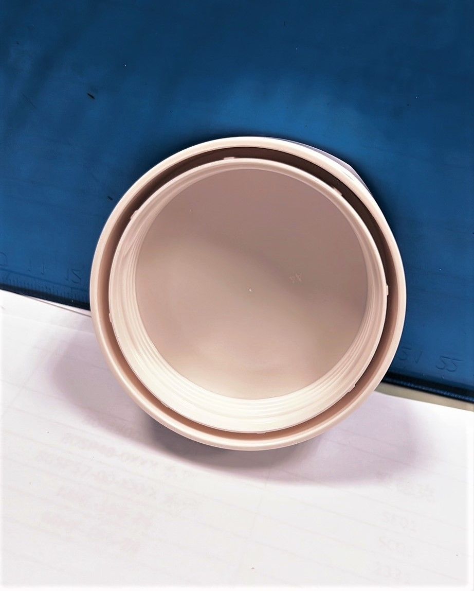 A white bowl is sitting on a blue surface