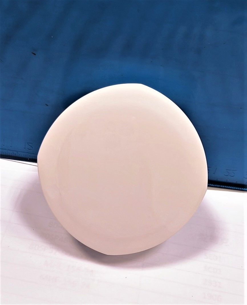 A white circle is sitting on a blue surface.