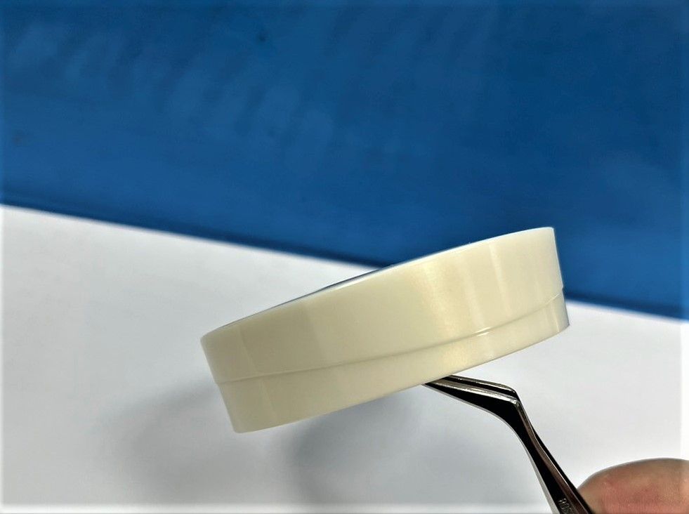 A person is holding a piece of tape with tweezers.