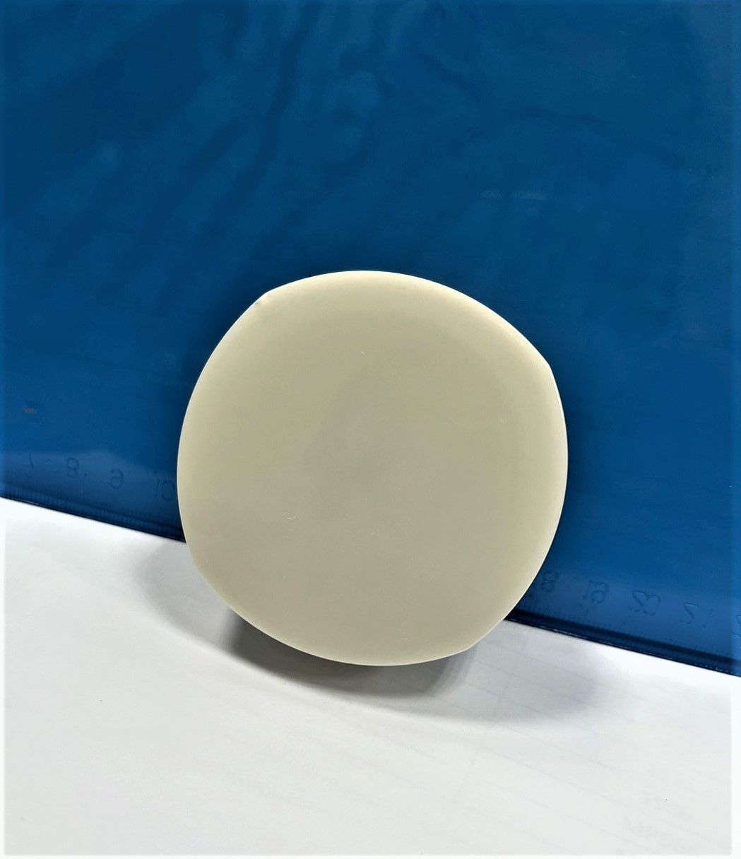 A white circle is sitting on a blue surface