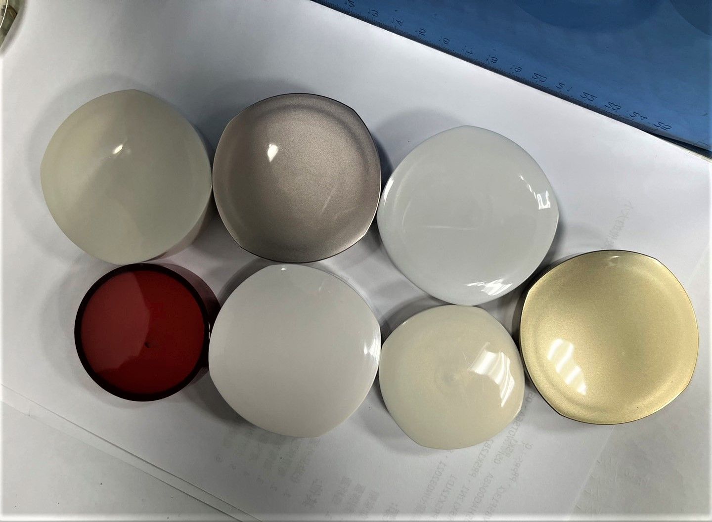 A bunch of different colored balls are sitting on a table