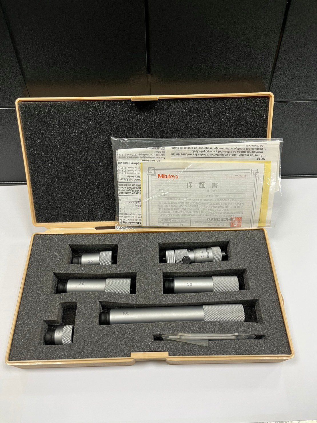 A box with a lot of tools inside of it