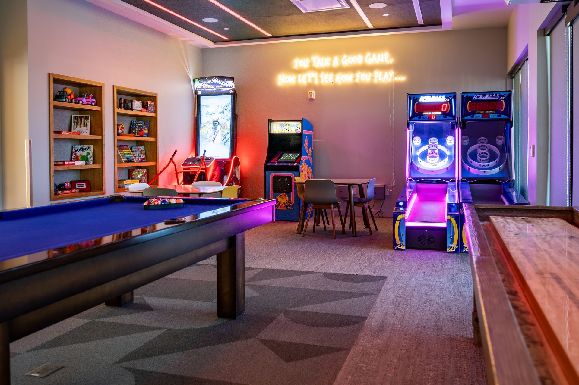 Canyon Village Resort game room with a pool table and arcade games.