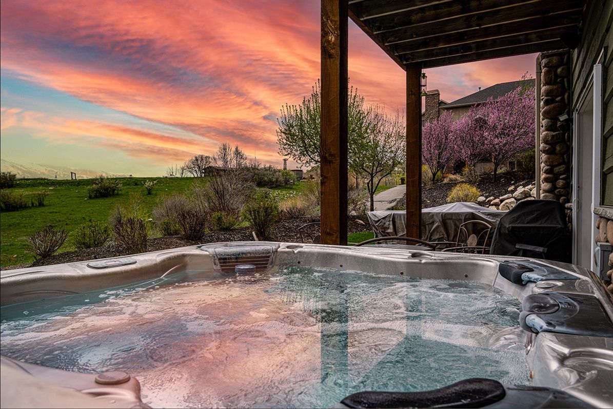 Sunset view from the hot tub at Snowcrest Summit Retreat in Eden Utah