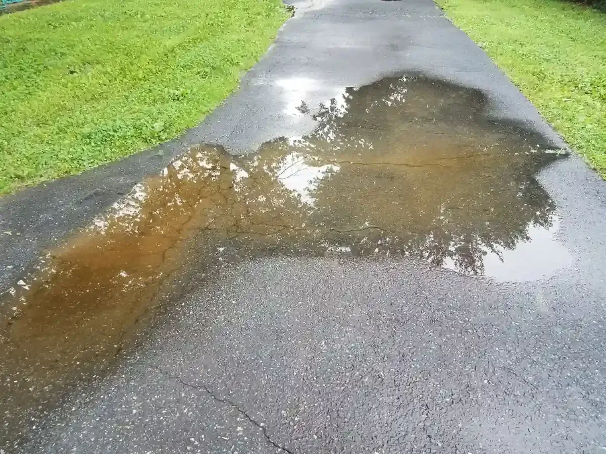 Water Management in concrete driveway that causes it fail early