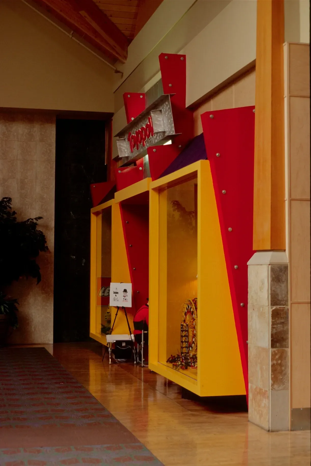 A red and yellow shelf with the word kodak on it