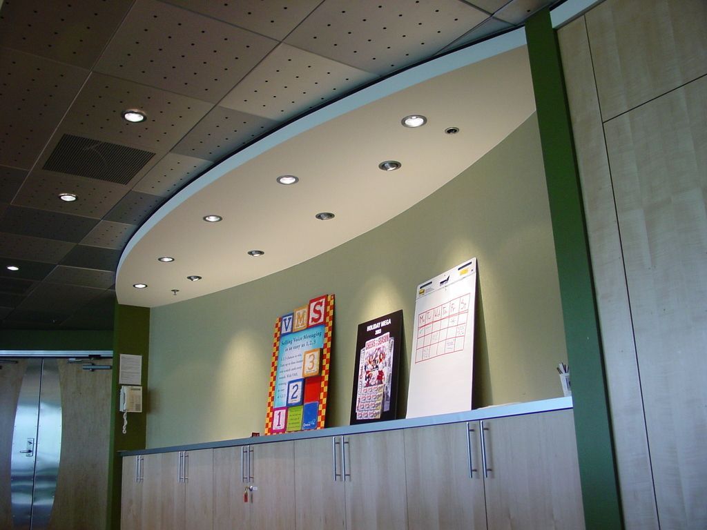 A sign on a wall that says oops on it