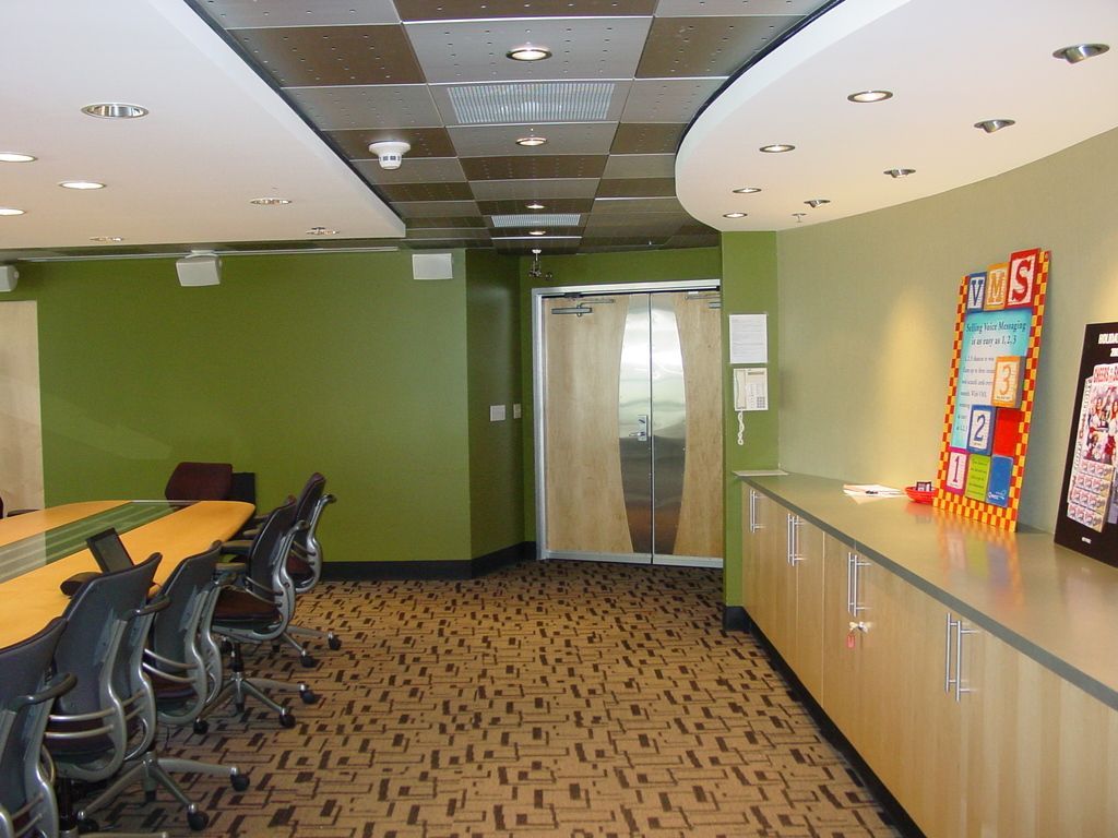 A room with a bulletin board that says abs on it