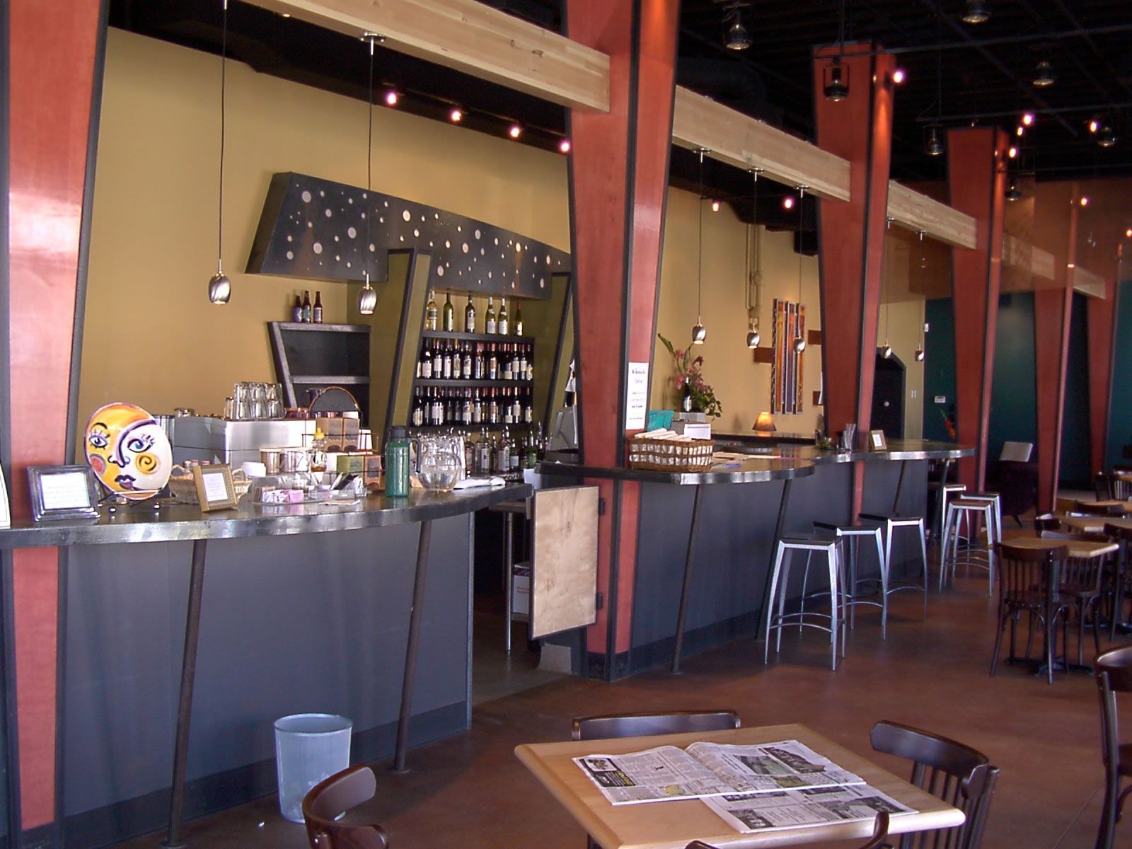 A restaurant with tables and chairs and a bar