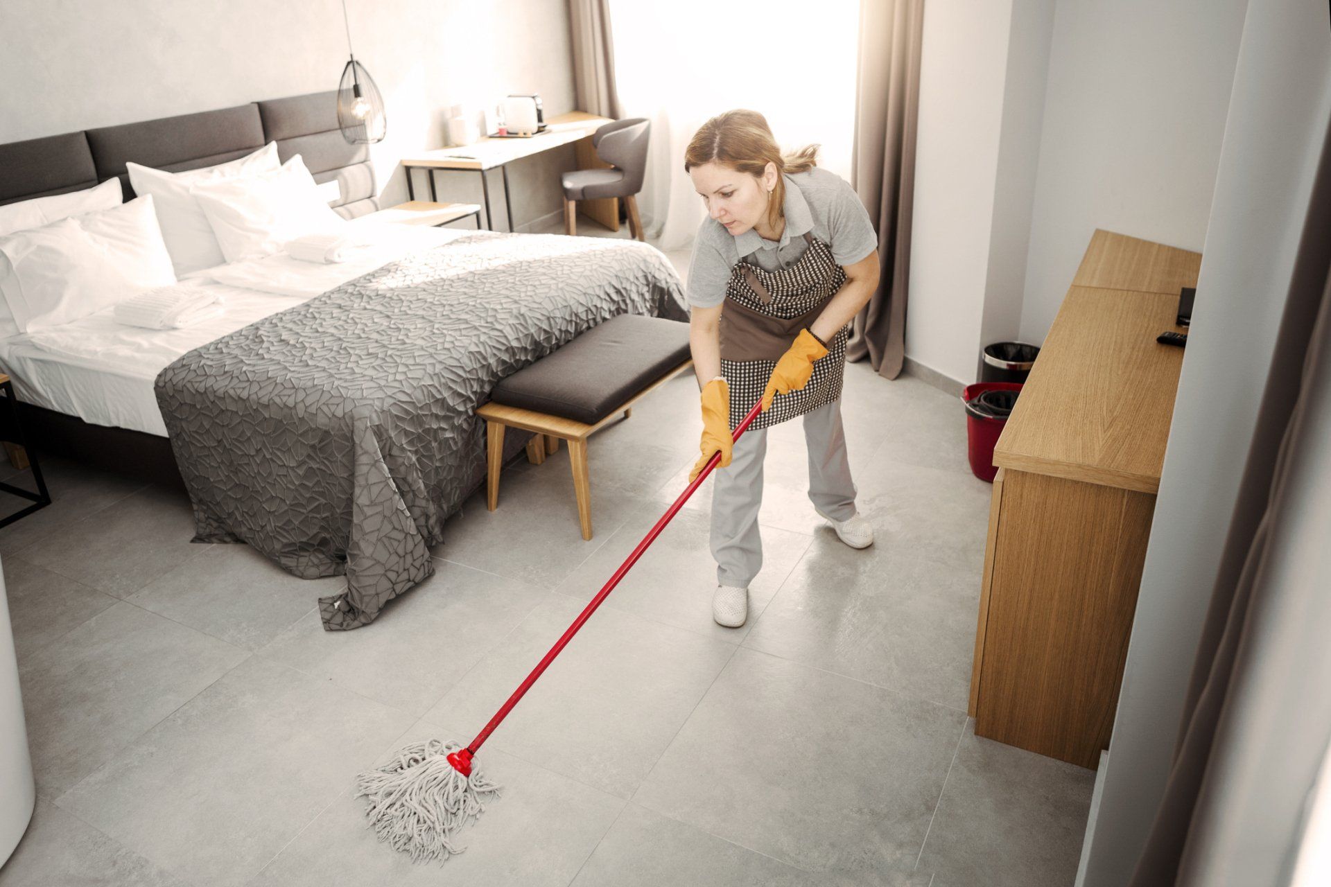 Woman Mopping the Floor— Medford, OR — Rogue Valley Maids