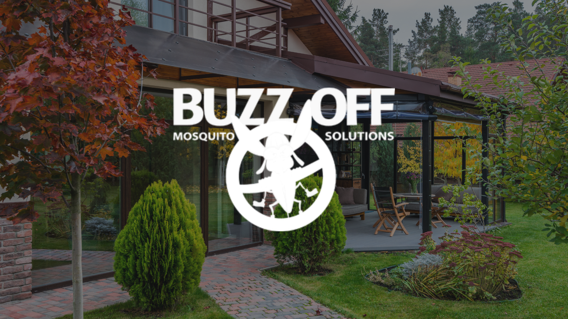 The logo for buzz off mosquito solutions is on a grassy field.