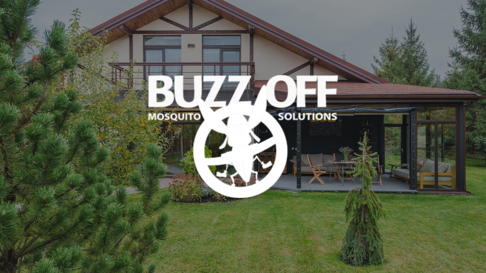 A logo for buzz off mosquito solutions is on a lush green lawn.