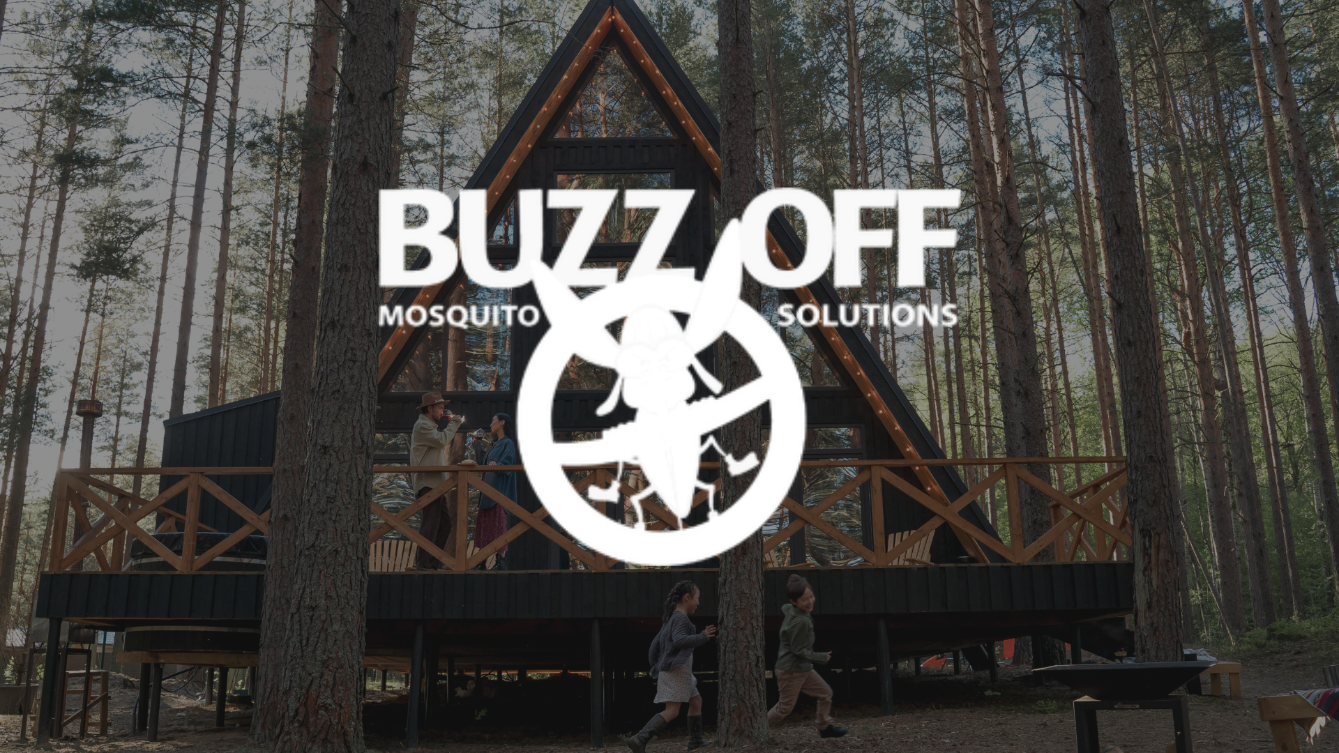 A logo for buzz off mosquito solutions is on a lush green lawn.
