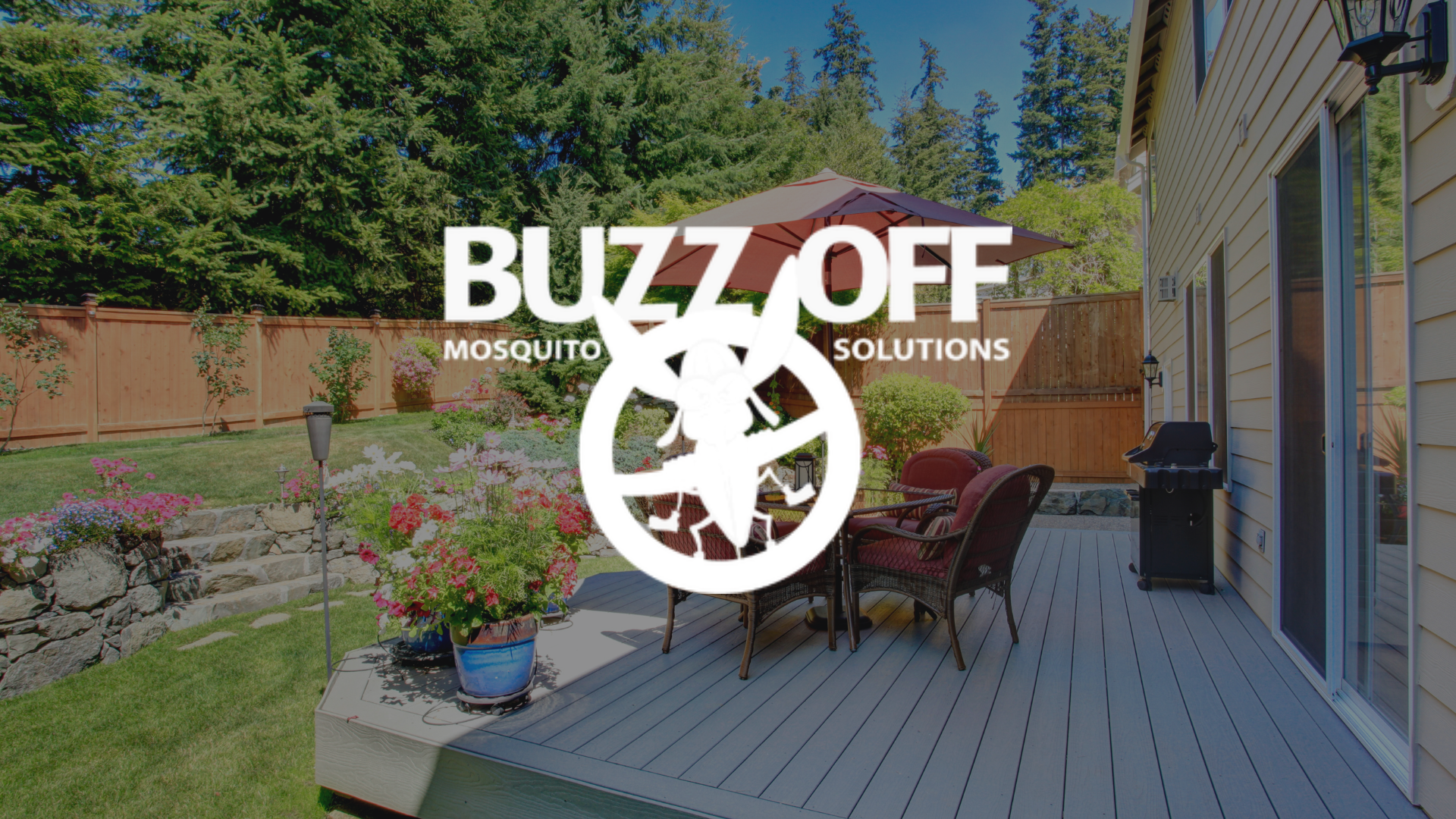 The logo for buzz off mosquito solutions is on a patio with a table and chairs.