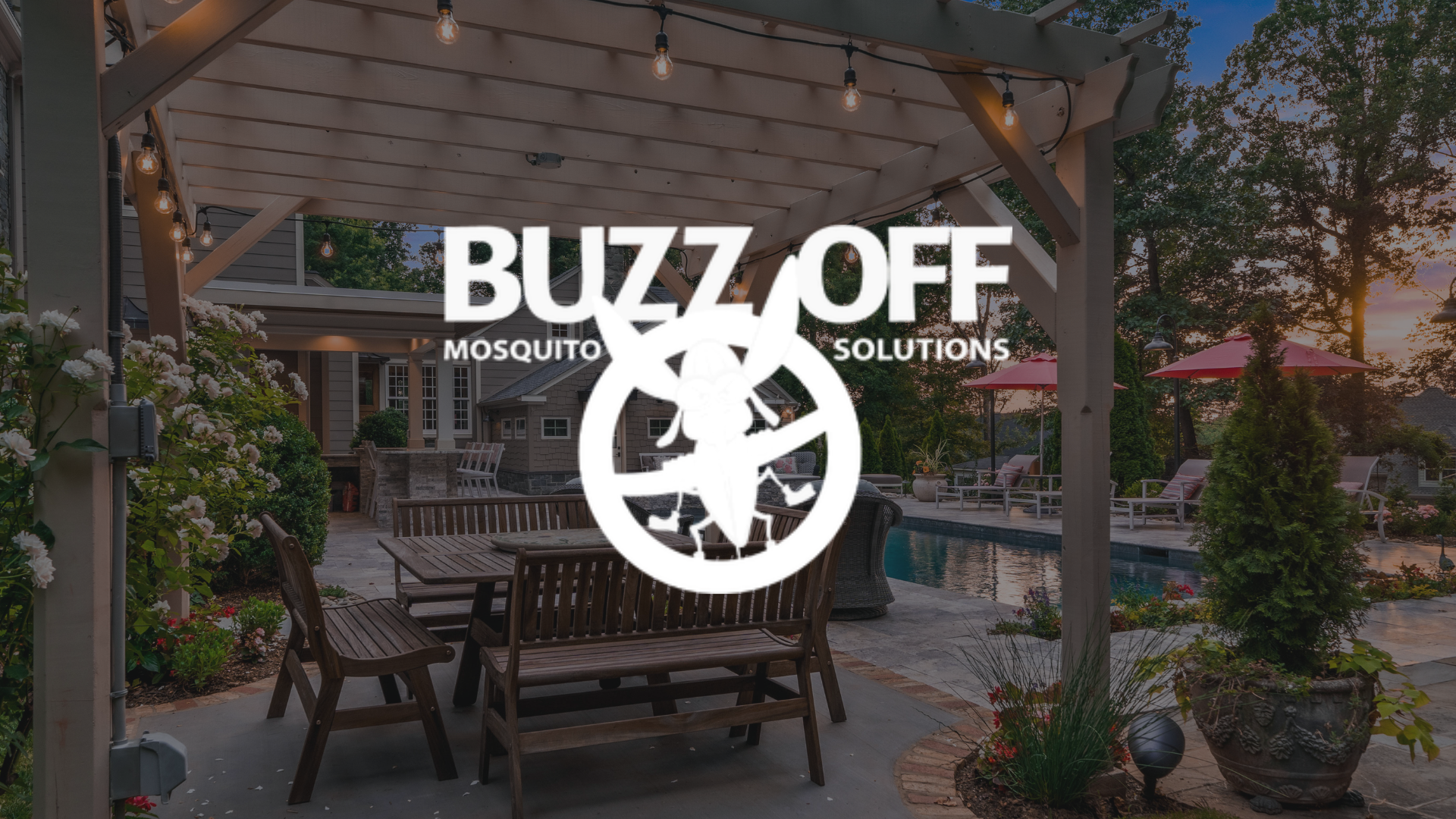 The logo for buzz off mosquito solutions is on a patio with a table and chairs.