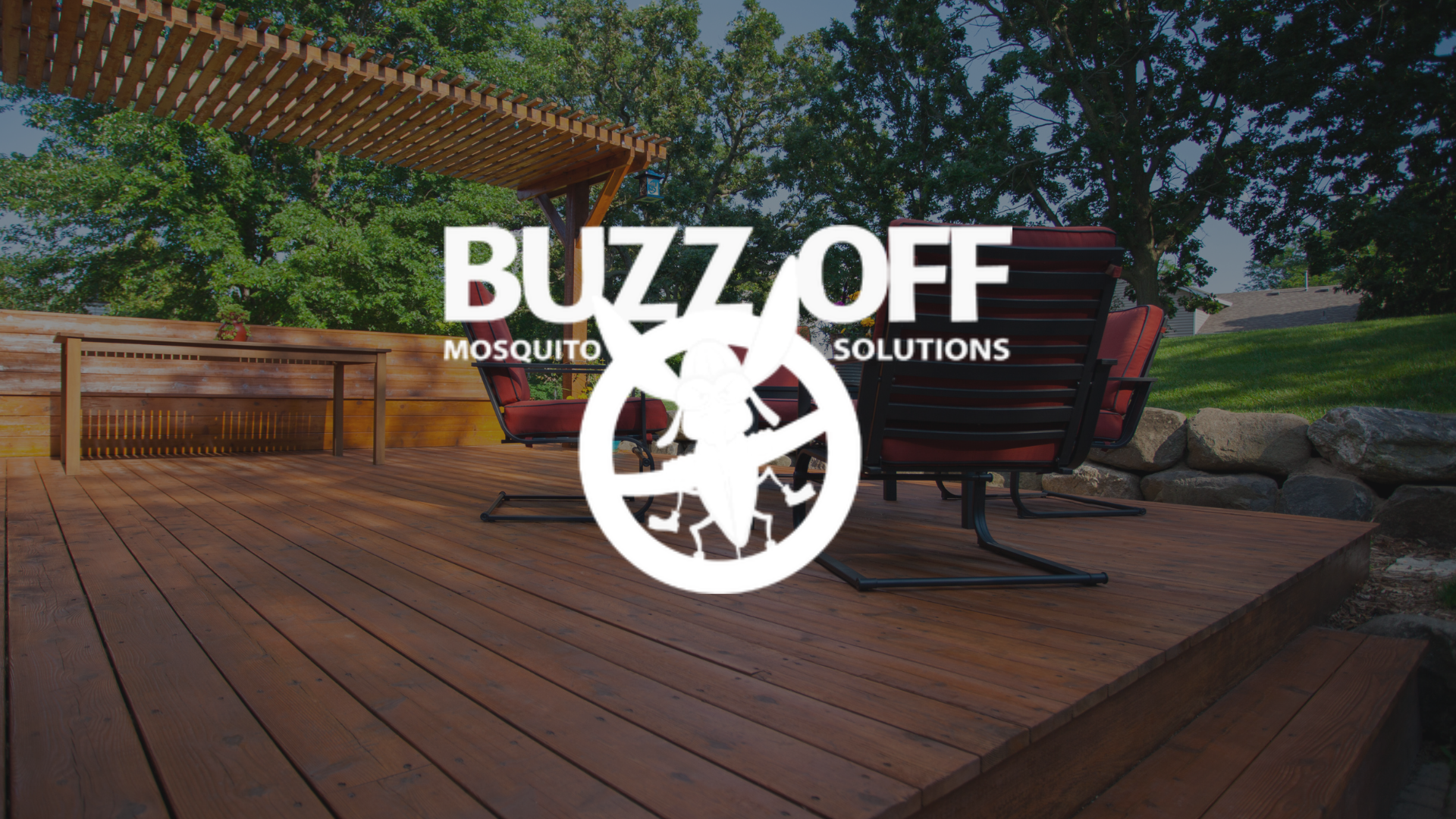 The logo for buzz off mosquito solutions is on a wooden deck.