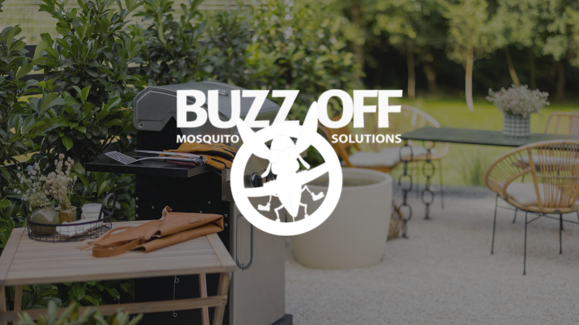 The logo for buzz off mosquito solutions is on a patio with a grill and chairs.