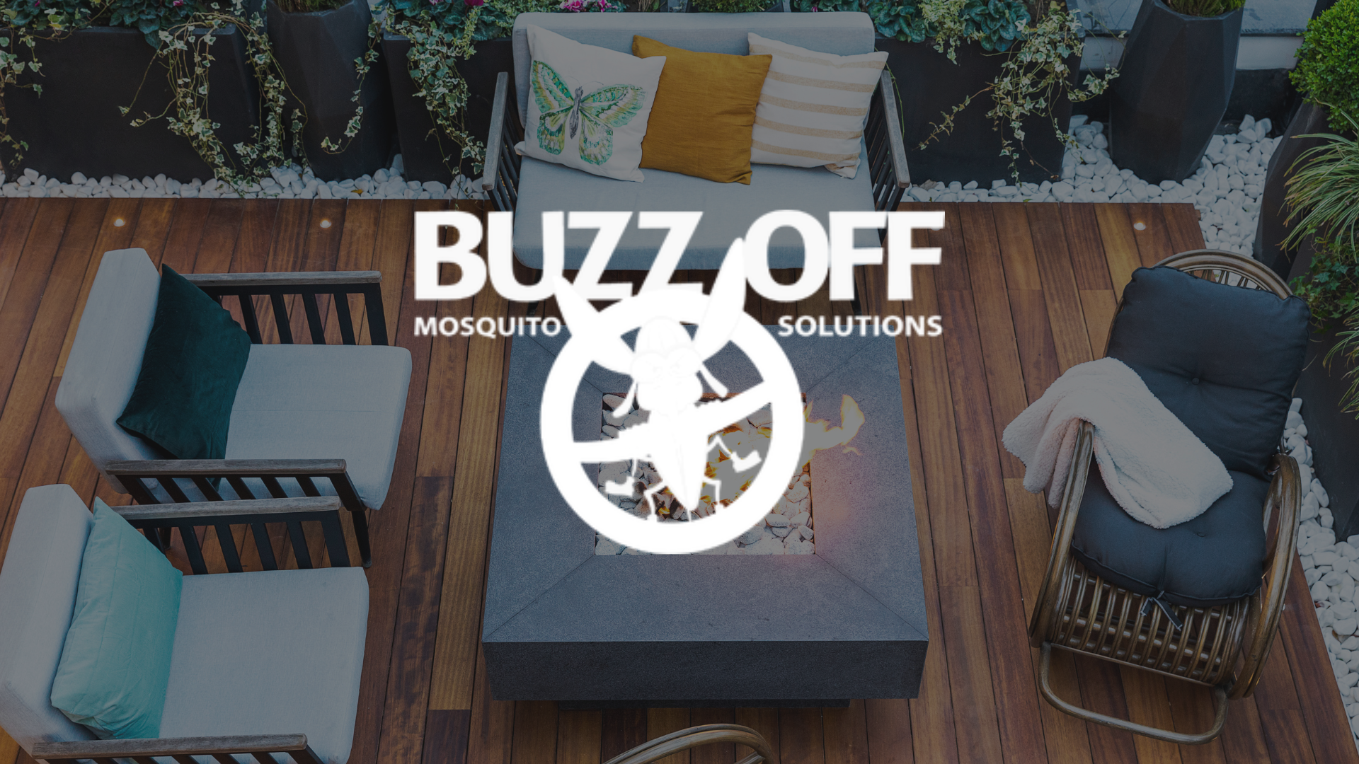The logo for buzz off mosquito solutions is on a wooden deck.